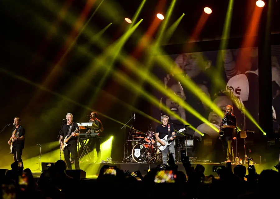 Live performance illuminated by dramatic stage lighting